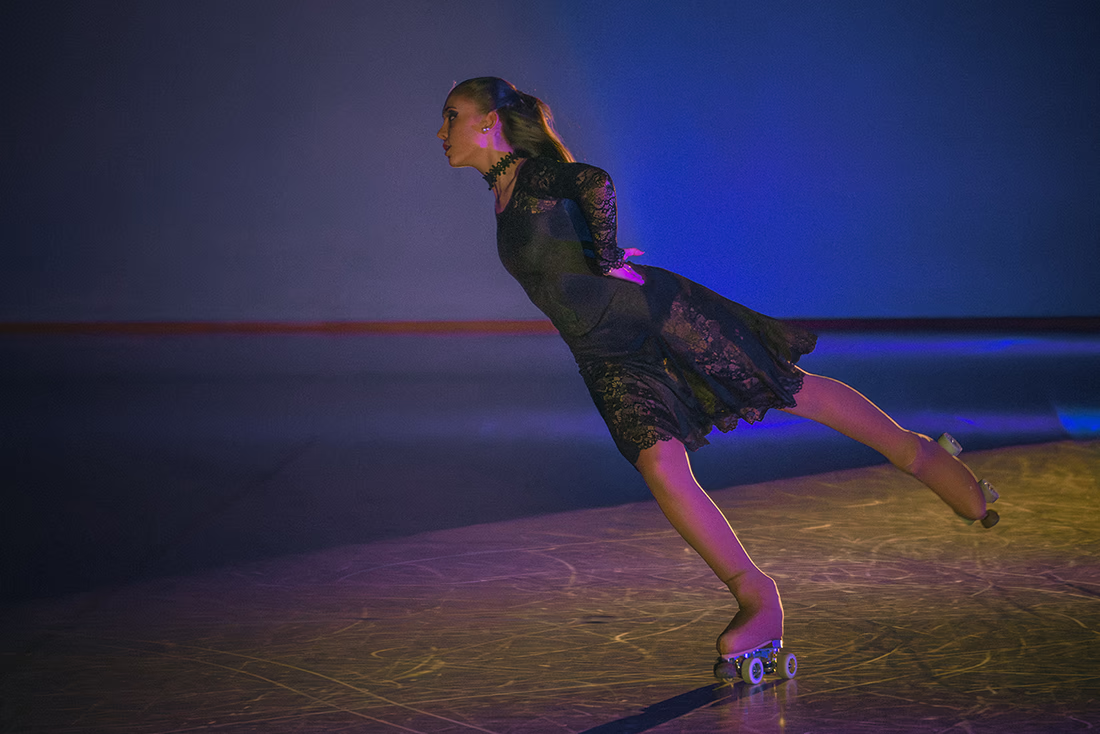 Photo of a female artistic skater during a show.