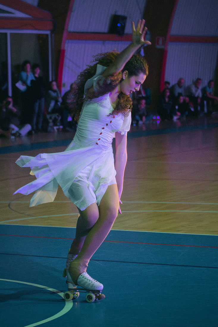 Photo of a female artistic skater during a show.