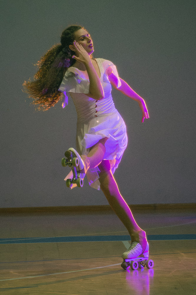 Photo of a female artistic skater during a show.