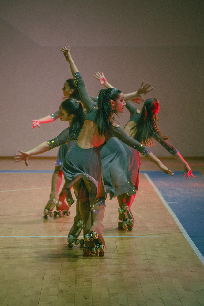 Photo of a quartet of artistic skaters during a show.