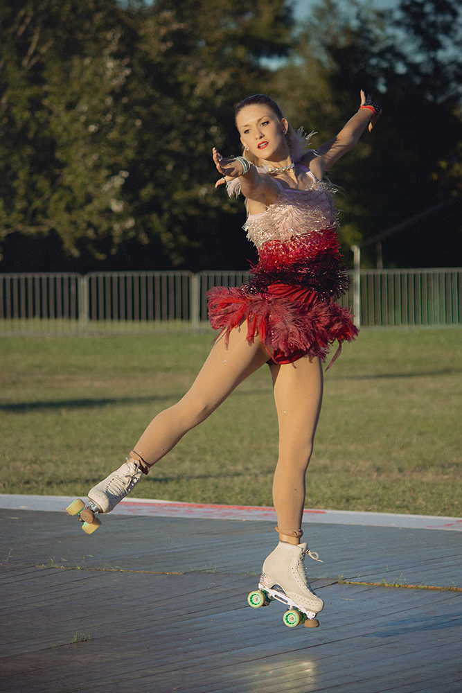 Photo of a female artistic skater during an open-air show.