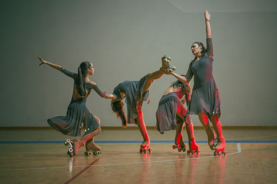 Photo of a quartet of artistic skater during a show.