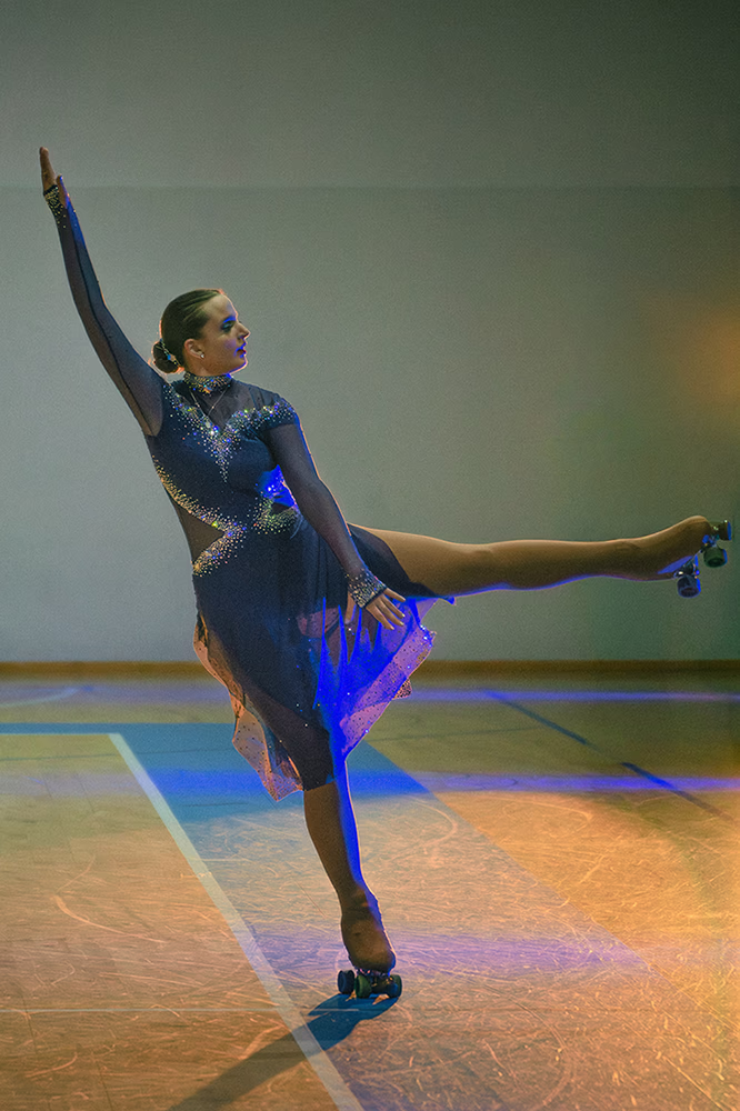 Photo of a female artistic skater during a show.