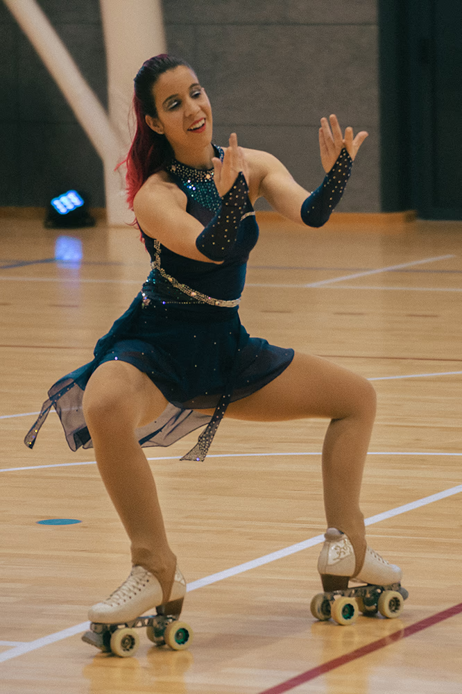 Photo of a female artistic skater during a show.