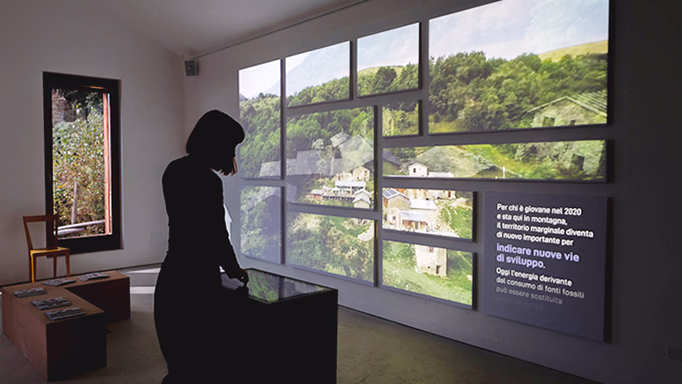 Photograph of Laura Faraci testing an interactive installation.